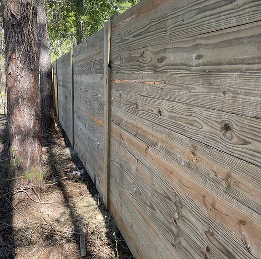 A tall wood Privacy Fence with no way to see through it